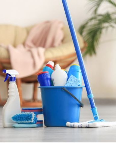 Organized cleaning supplies gathered in a caddy basket