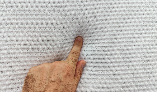 Professional upholstery cleaning machine extracting dirt from a fabric sofa