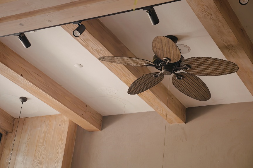 Modern ceiling fan on concrete ceiling