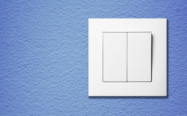 White light switch on clean interior wall